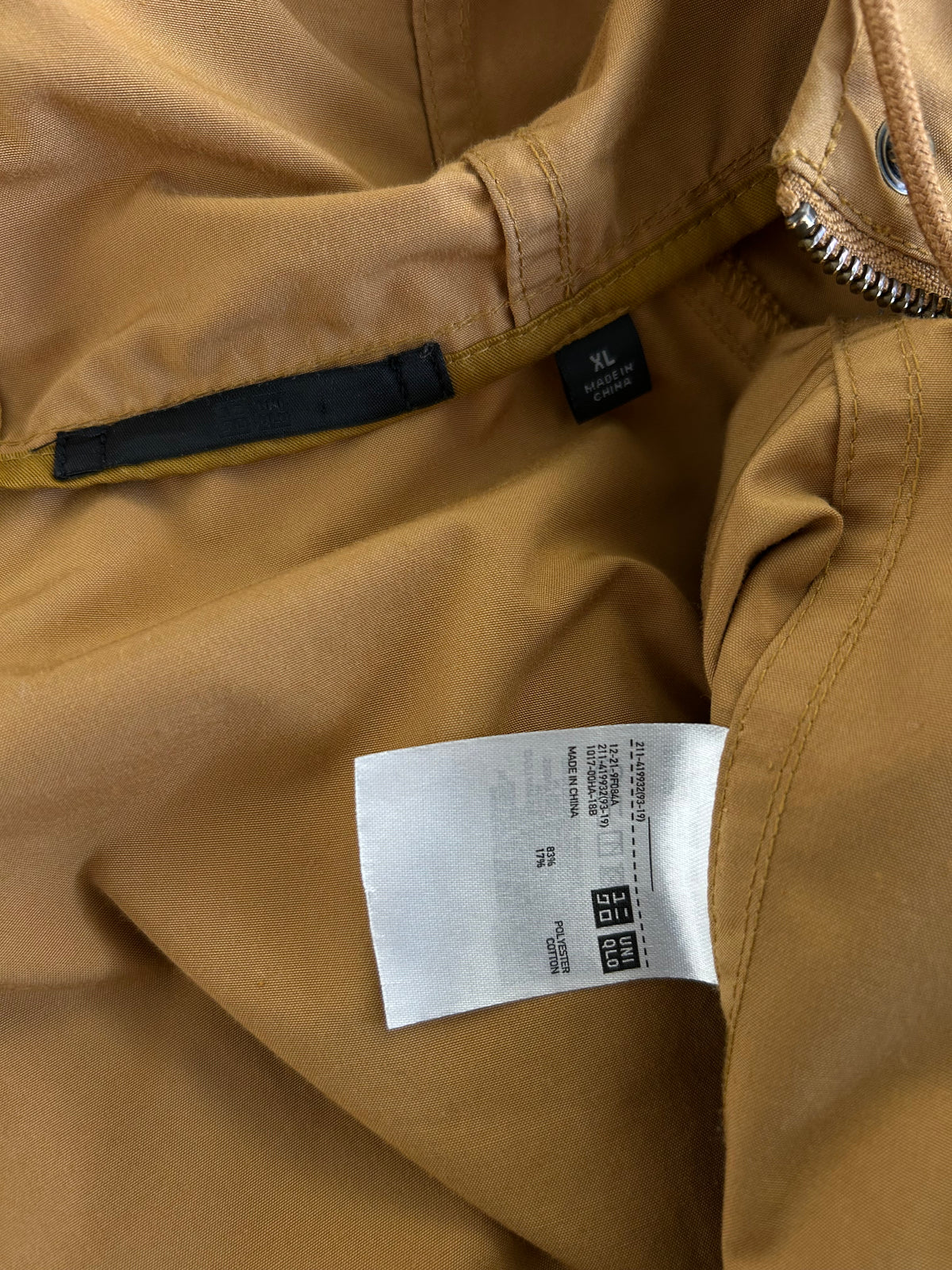 Uniqlo mustard yellow oversized hooded parka featuring large utility flap pockets on the front