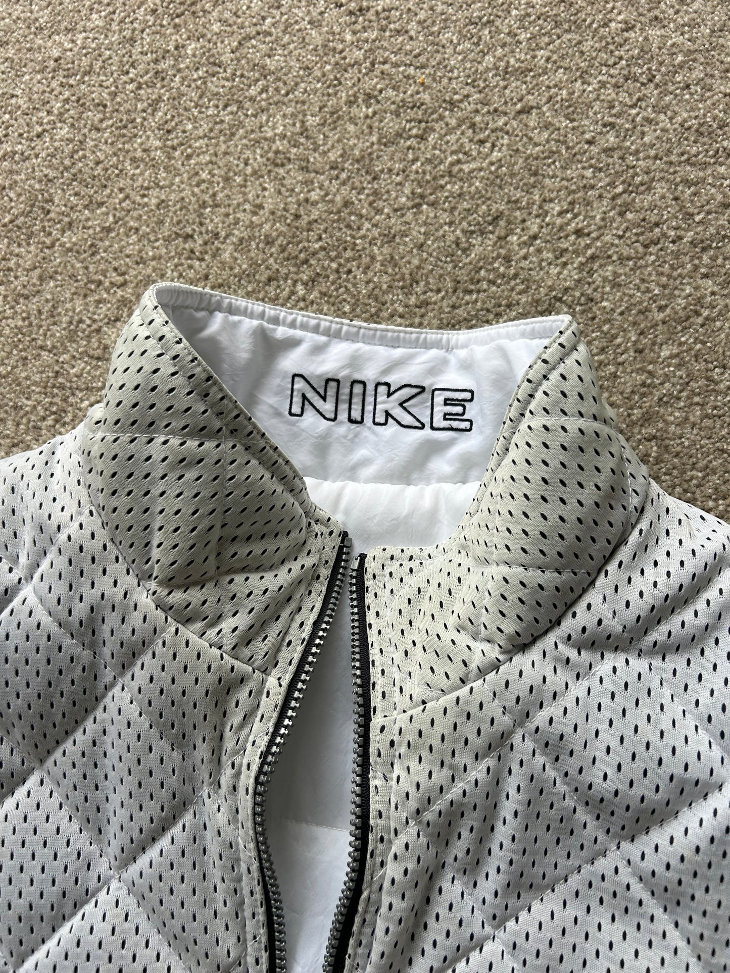Vintage Nike Sportswear Reversible Puffer Vest in black and white XL