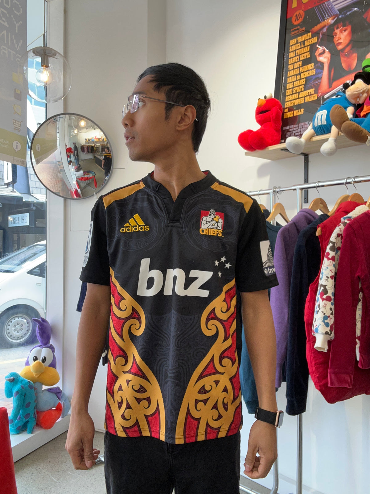 adidas 2014/15 Chiefs Super Rugby home jersey, featuring the prominent black, red, and gold Māori design panels along the sides and the classic bnz sponsor logo across the chest.