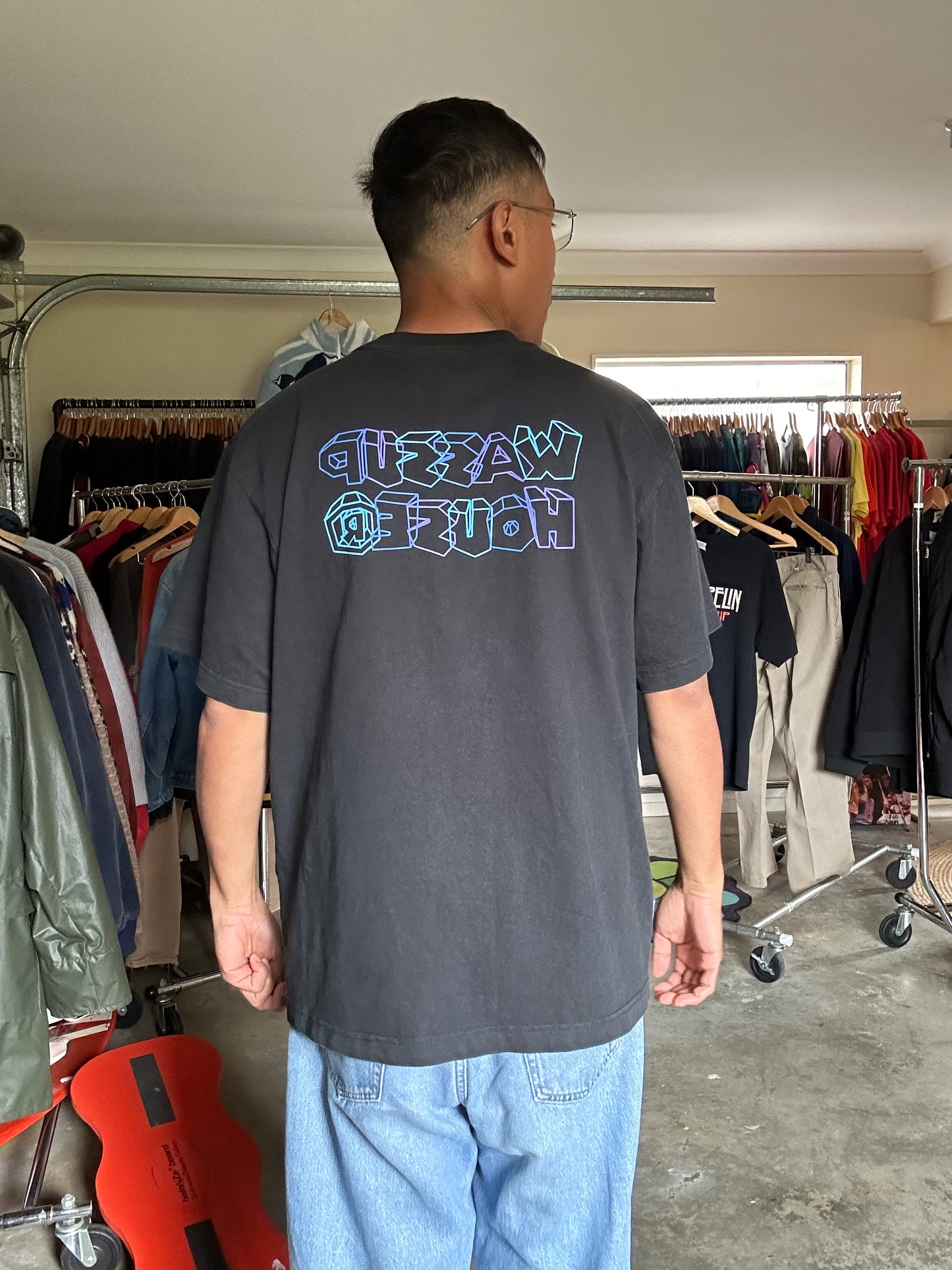 Wassup House, as indicated by the distinct "WH" logo on the chest Large Black