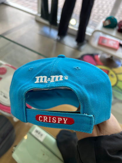 vintage 1999 M&M's Crispy "Orange" character advertising baseball cap in a vibrant turquoise blue.