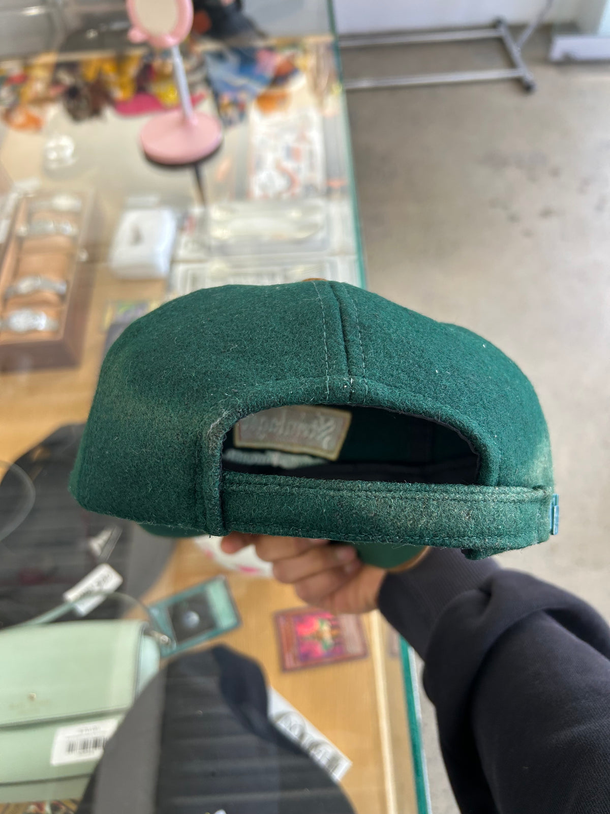 vintage Steinlager two-tone cap featuring a dark green crown and a contrasting tan brim