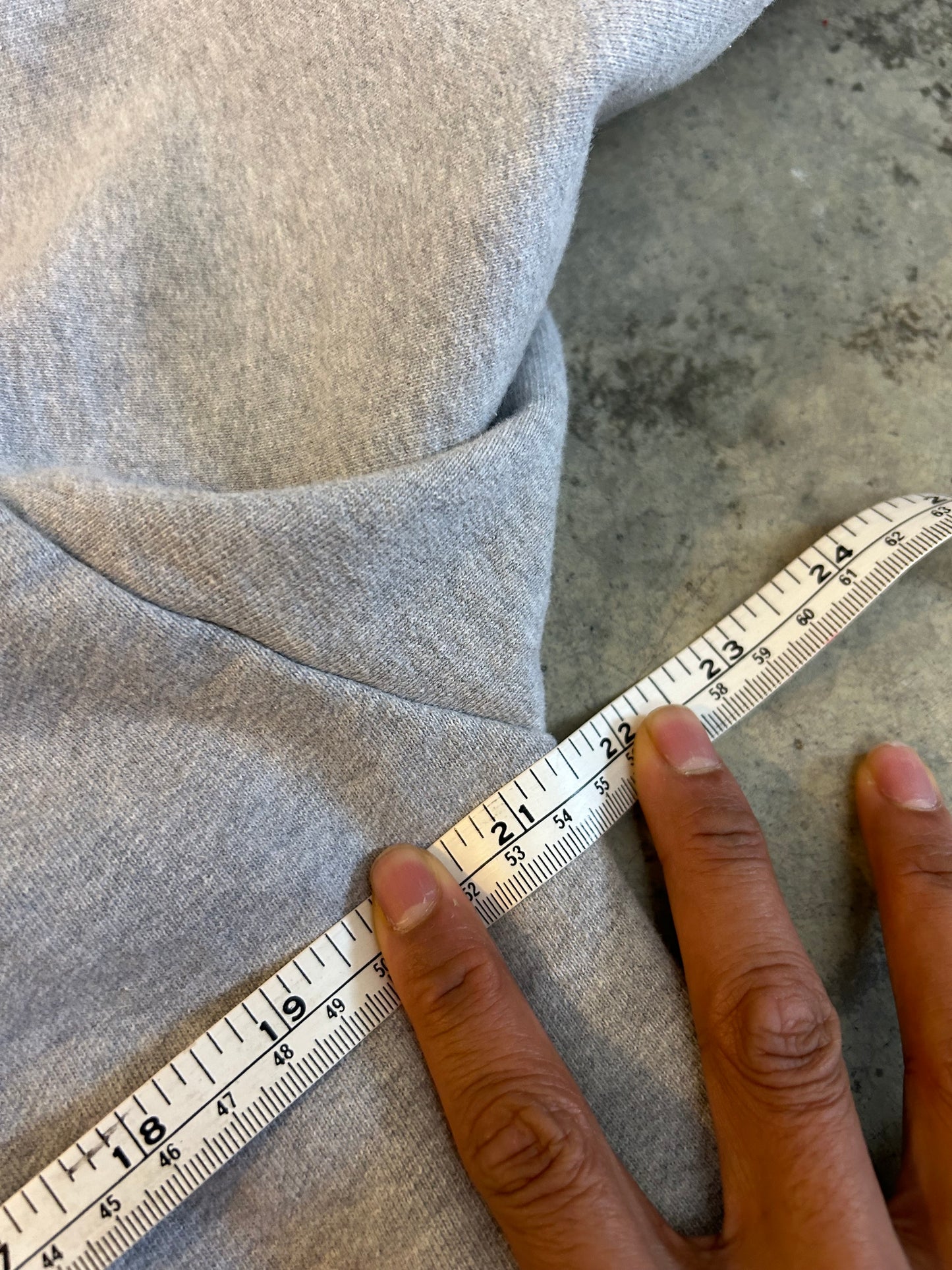 heather grey hoodie from Lower features a central "Lower" graphic of a hand on a vinyl record with star accents Medium