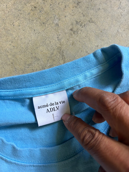 Acmé de la vie (ADLV) Glossy Basic Logo Short Sleeve T-Shirt in blue. Large