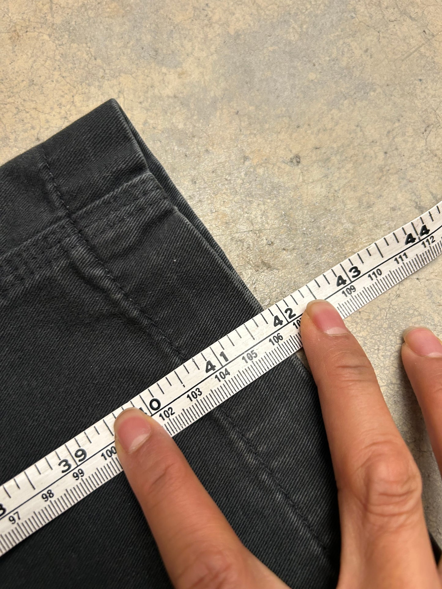 vintage Carhartt Carpenter pants, characterized by a faded black finish and utility features like a hammer loop size 36