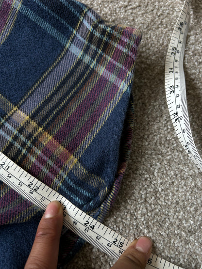 Patagonia Women's Long-Sleeved Fjord Flannel Shirt in a blue and purple plaid pattern, made from 100% organic cotton