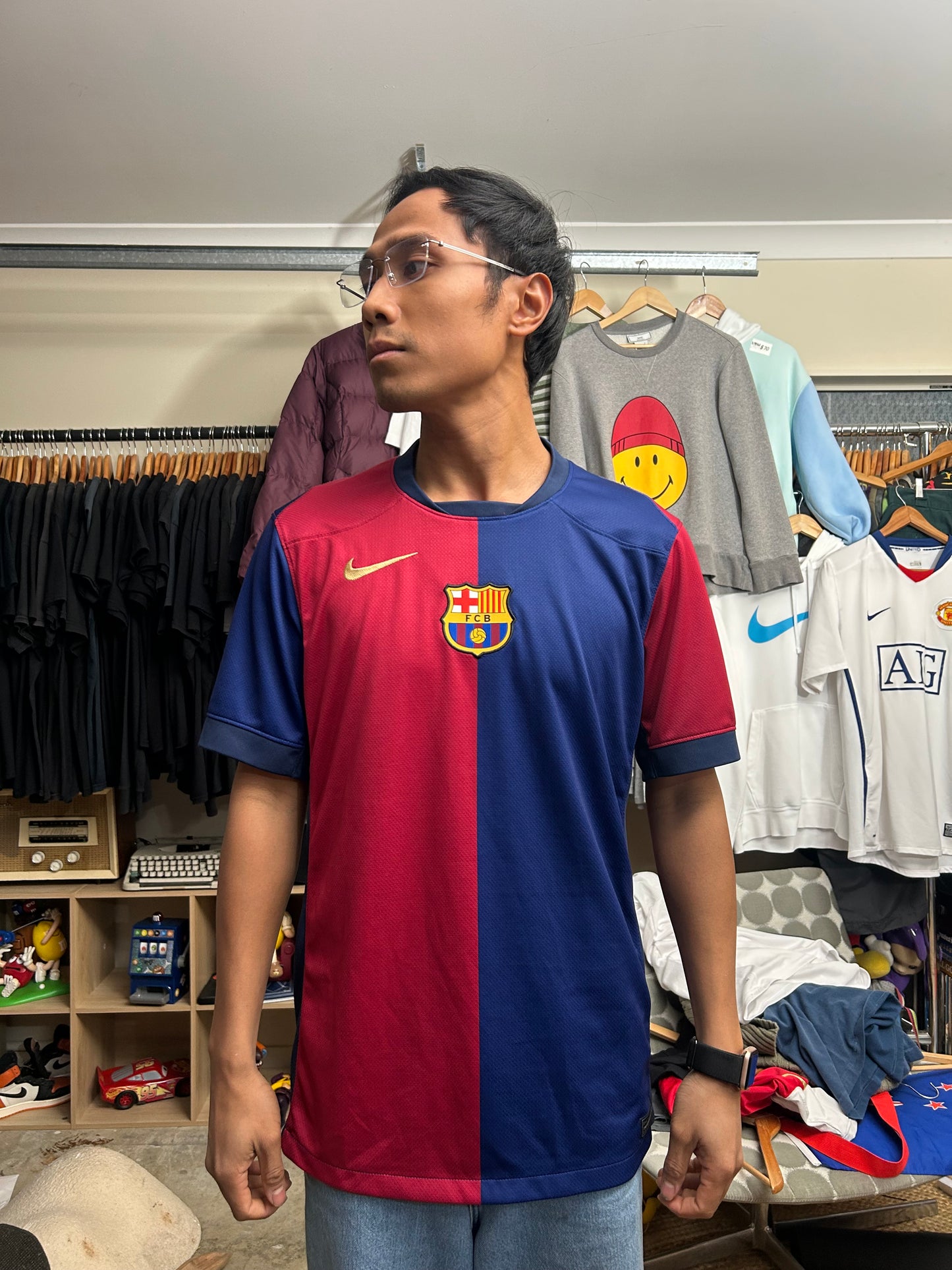 Nike FC Barcelona 2024/25 Home Jersey features a distinct split red and blue design with a gold Nike Swoosh
