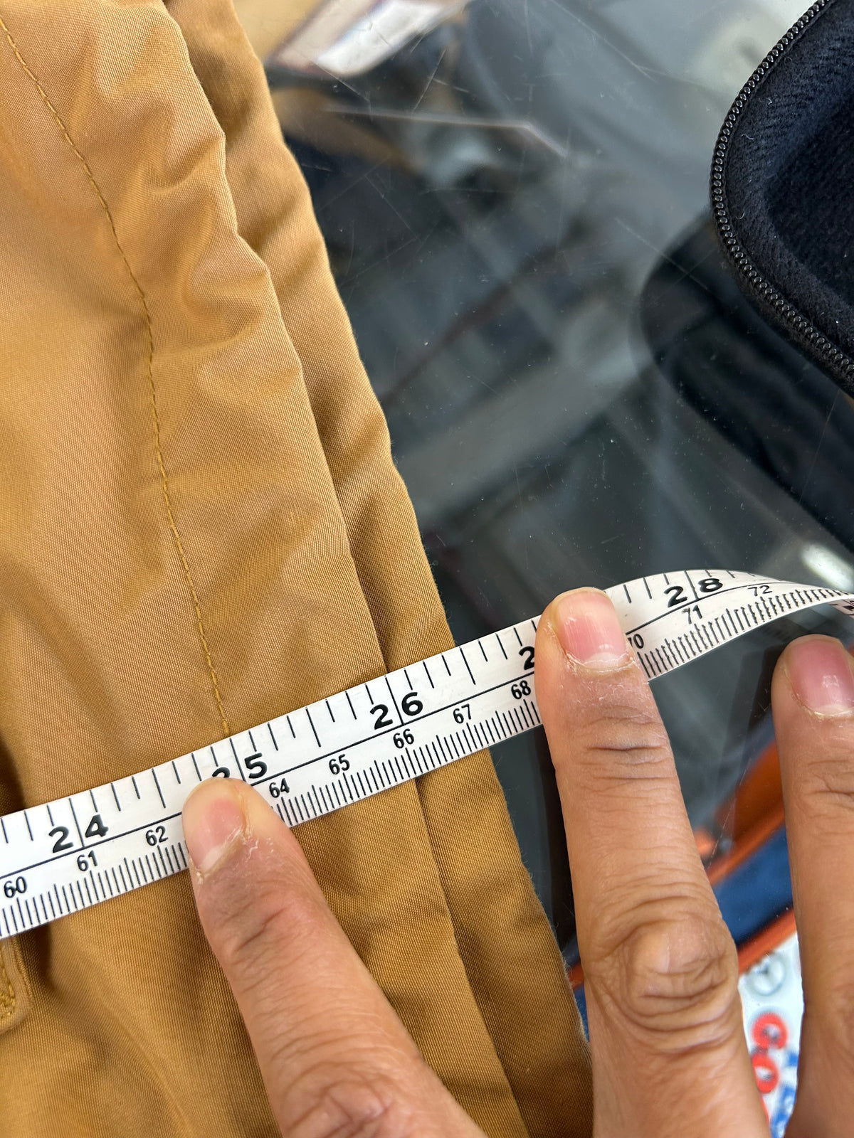 Uniqlo mustard yellow oversized hooded parka featuring large utility flap pockets on the front