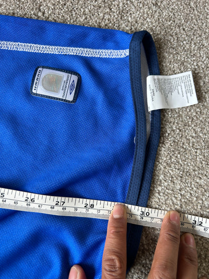 vibrant blue Umbro performance jersey featuring a V-neck design and white piping details XL