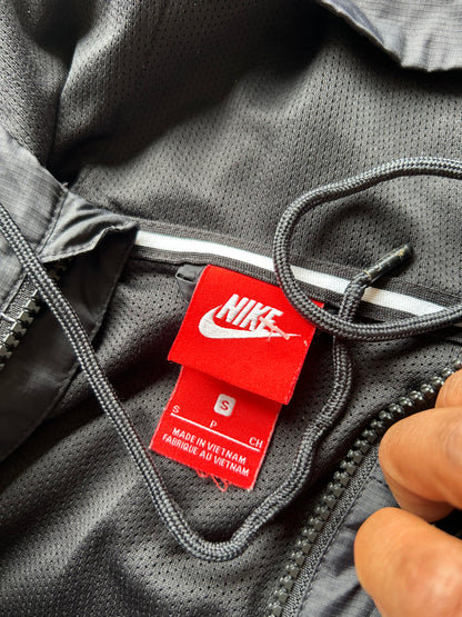 Nike Men's Sportswear Windrunner Jacket in a black, white, and dark grey colorway, model number AJ1396-010 Small