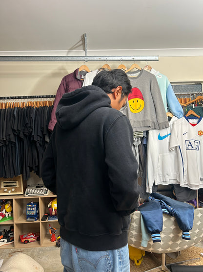 black Subtype Curated hoodie features a prominent kangaroo pocket and a clean, minimalist design Small