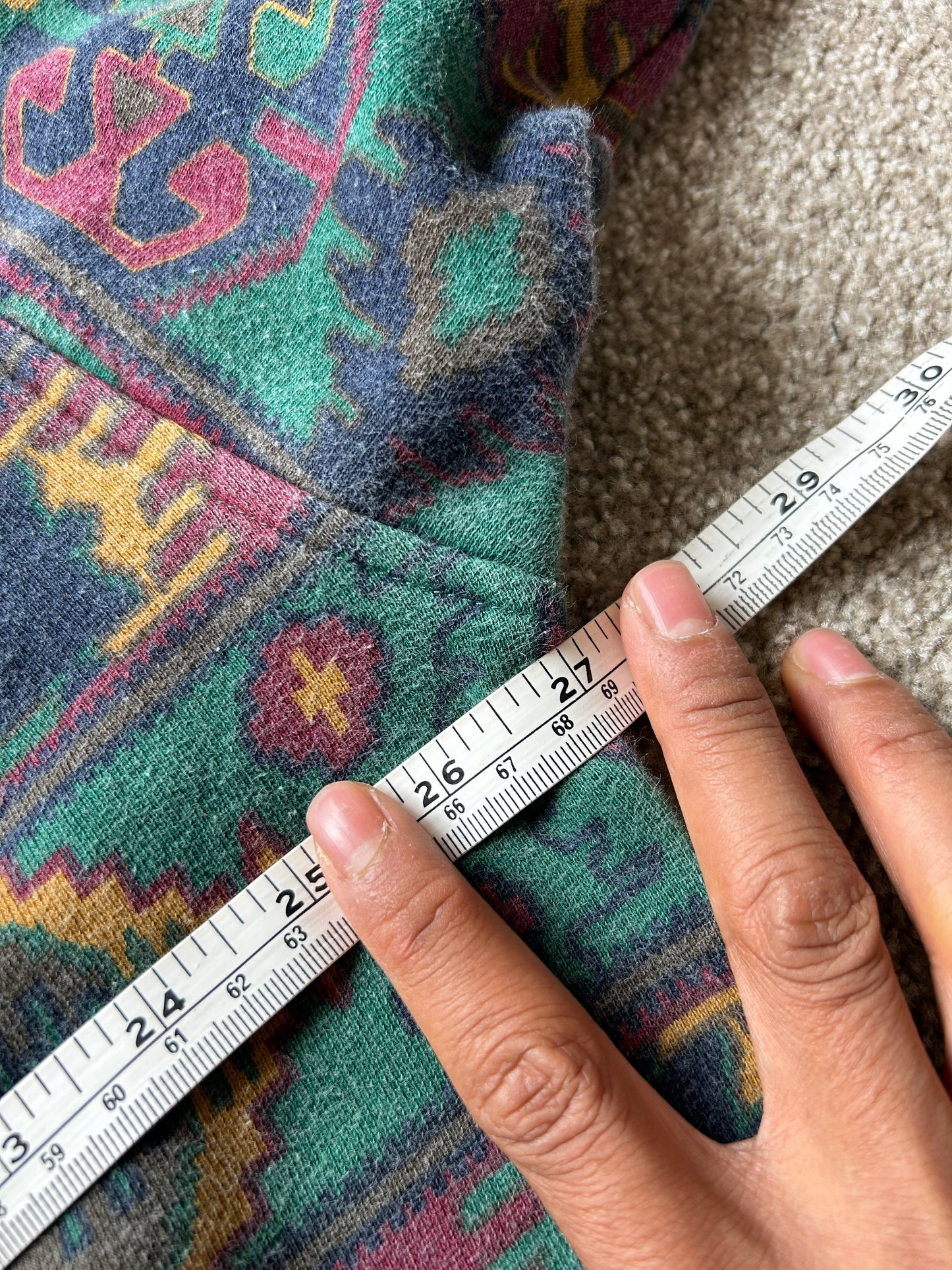 a dark green base with a multicolored Aztec and geometric pattern, characteristic of 1980s and 90s knitwear designs. XL