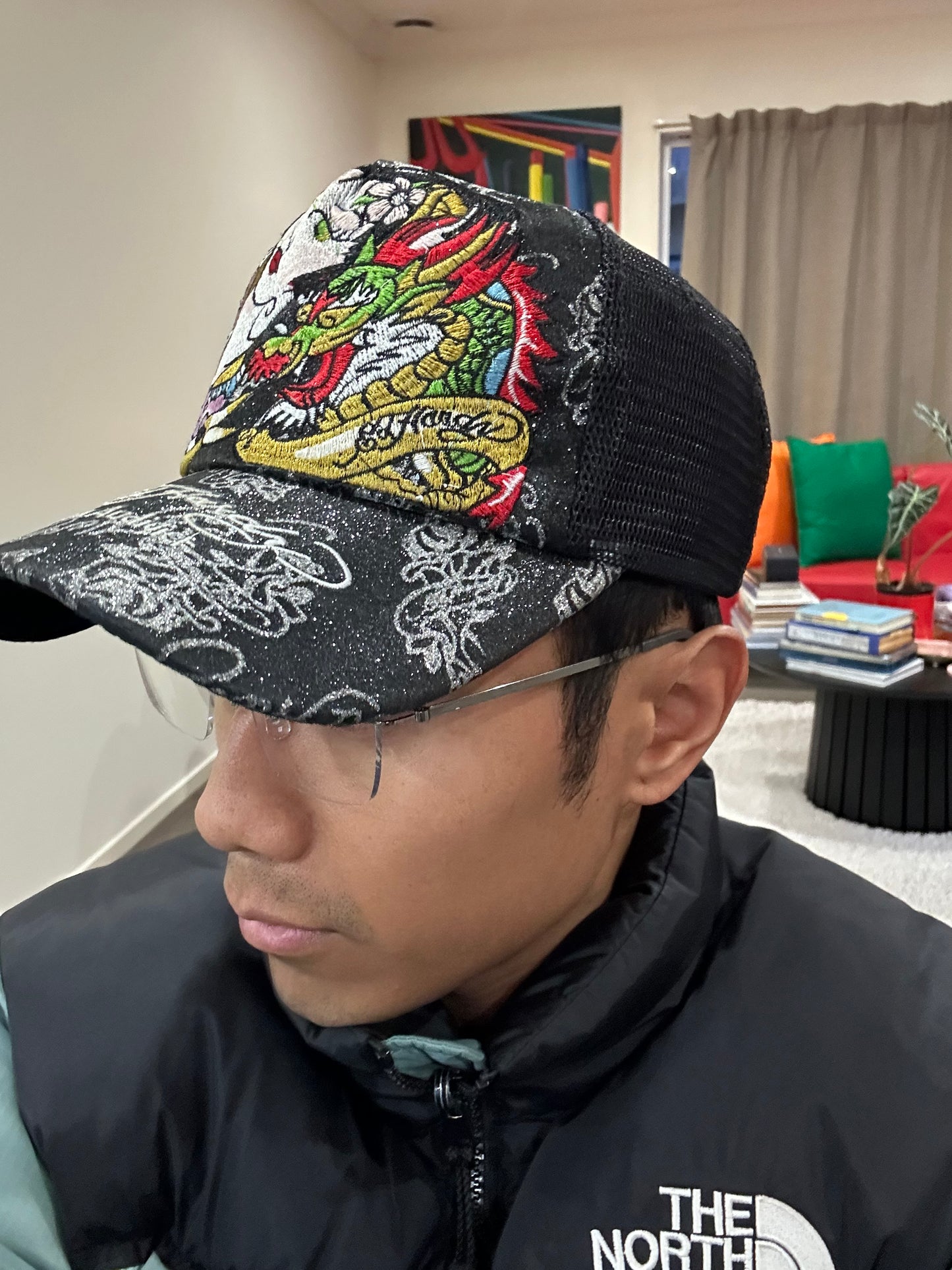 Vintage black Ed Hardy trucker cap features prominent embroidered dragon and geisha