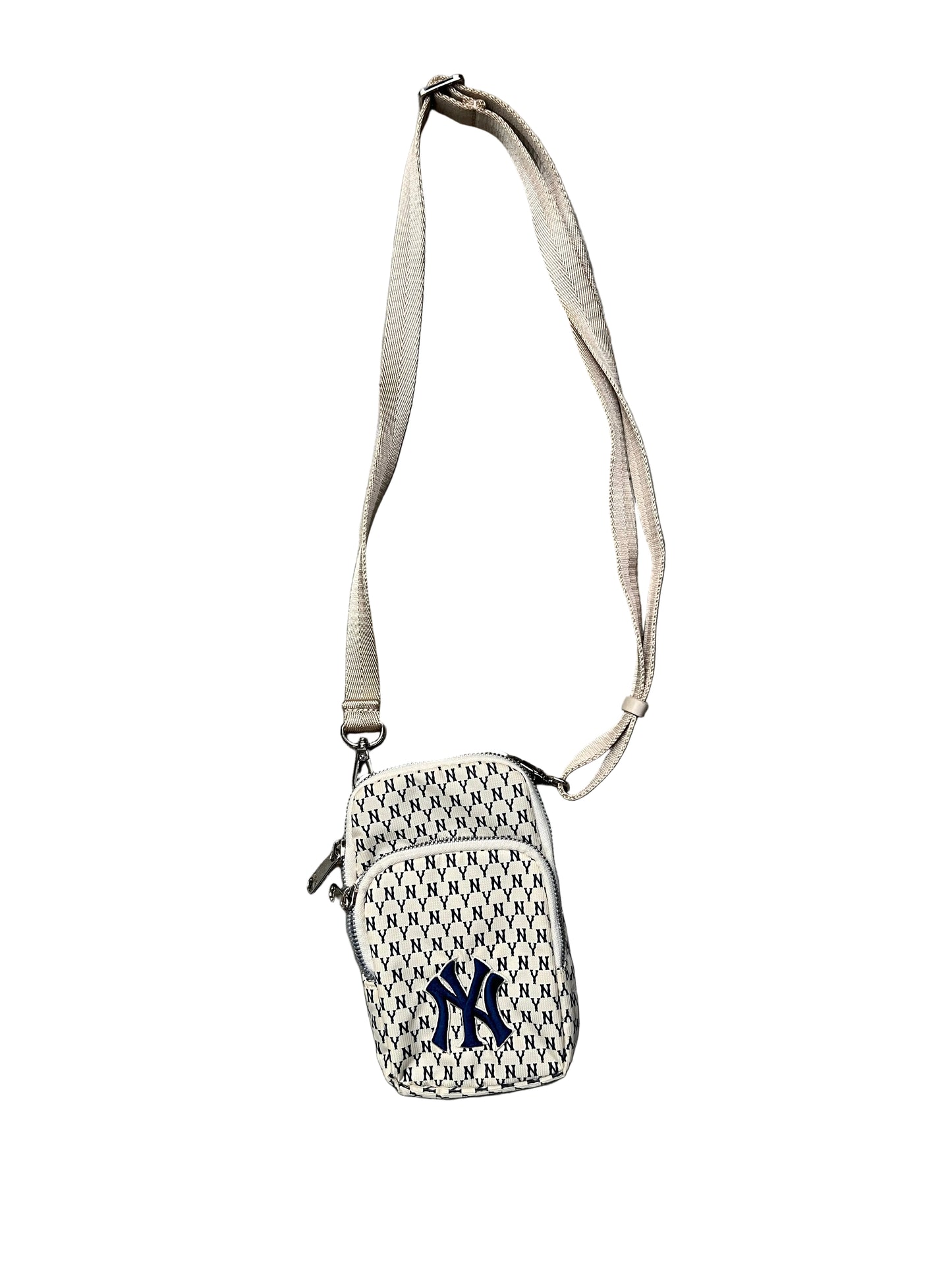 MLB New York Yankees mini bag features a repeating "NY" monogram pattern in ivory and blue