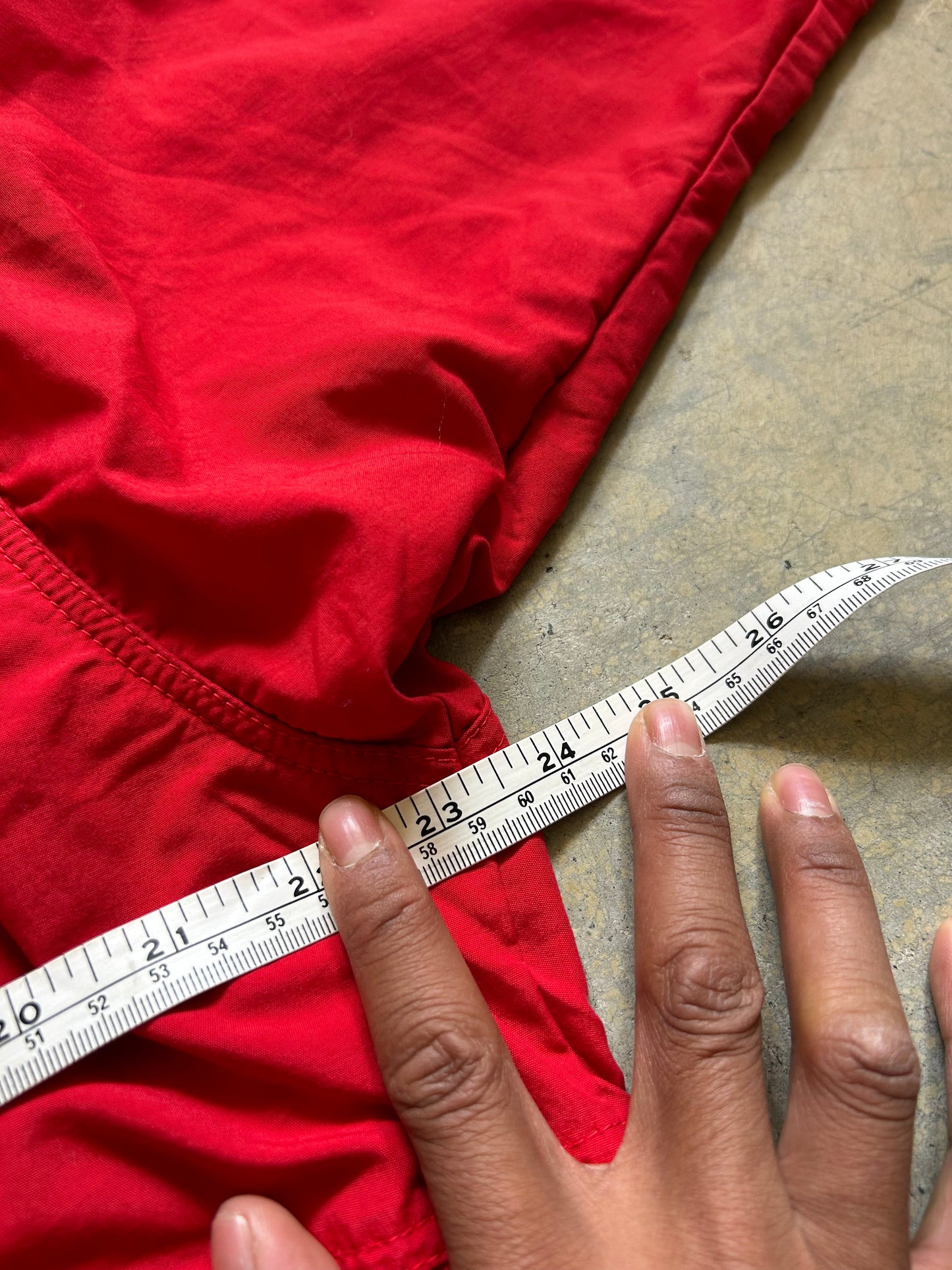 vintage Patagonia jacket, likely from the Fall Line collection, featuring a vibrant red shell and a purple collar Medium