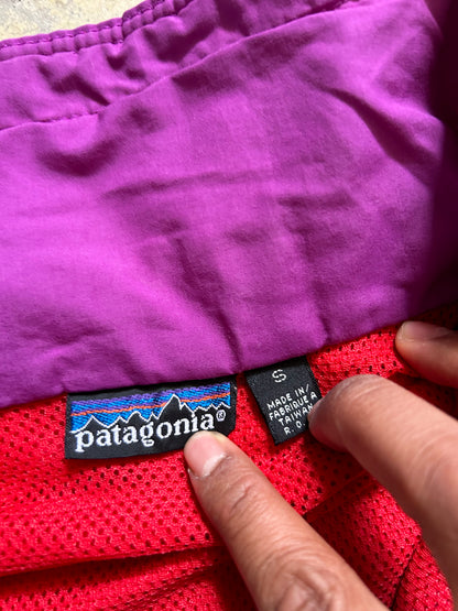 vintage Patagonia jacket, likely from the Fall Line collection, featuring a vibrant red shell and a purple collar Medium