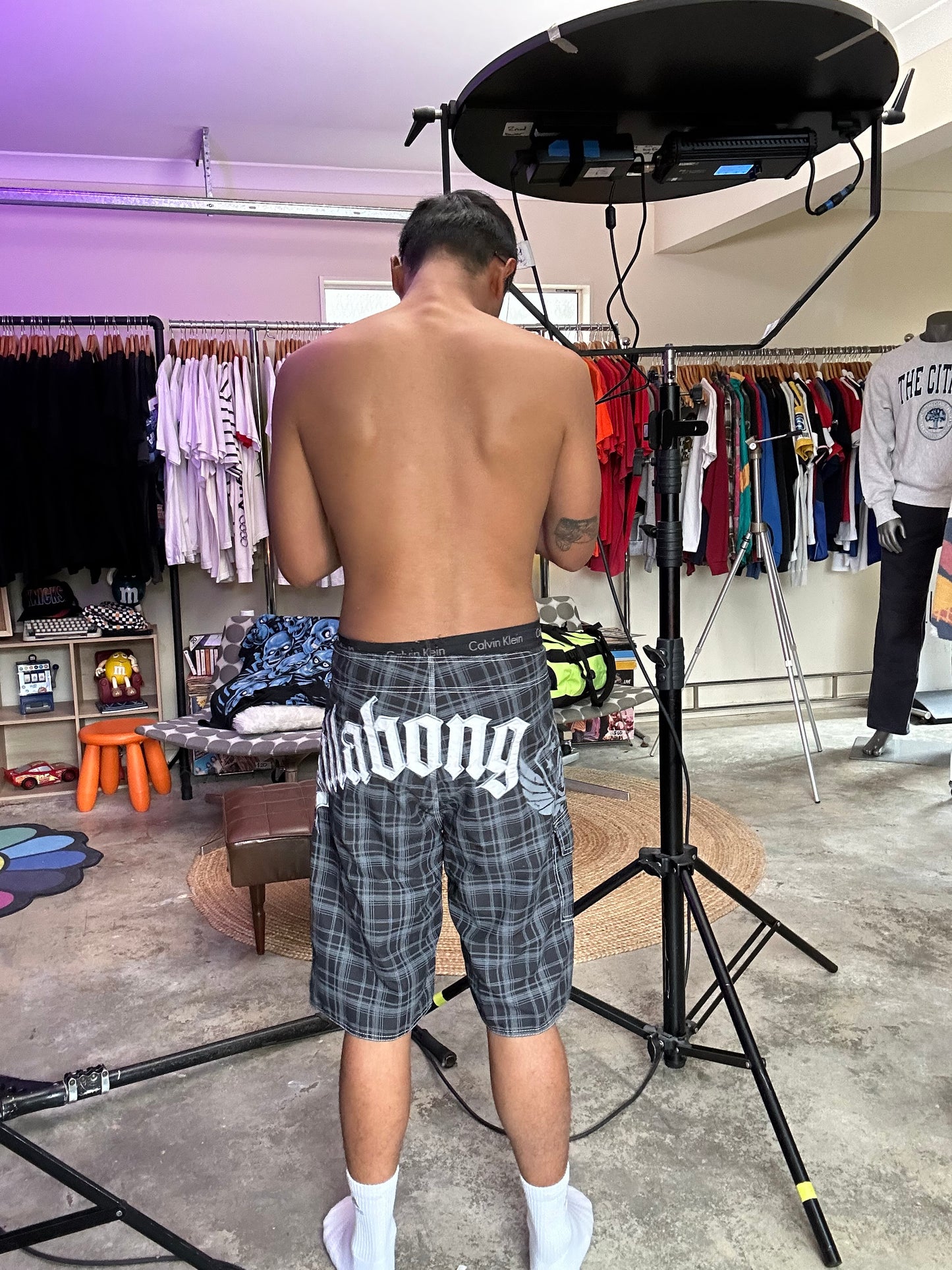 2000s Billabong black and grey plaid board shorts featuring a large embroidered logo on the back 32