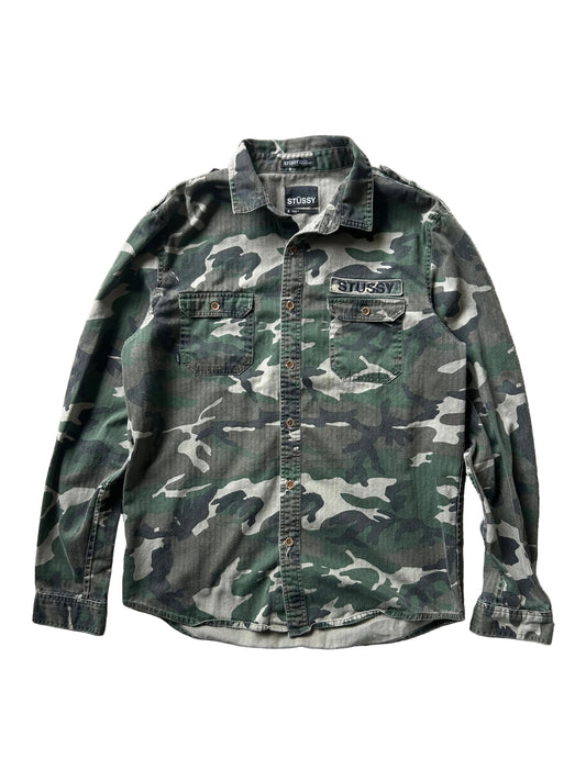 Stussy camouflage cargo shirt featuring a button-up front and a logo patch on the chest Medium