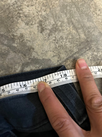 vintage Carhartt Carpenter pants, characterized by a faded black finish and utility features like a hammer loop size 36