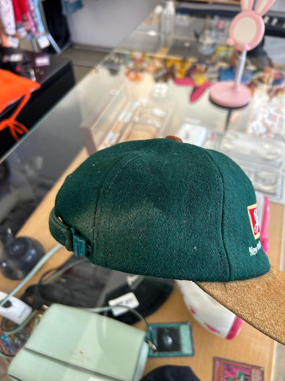 vintage Steinlager two-tone cap featuring a dark green crown and a contrasting tan brim
