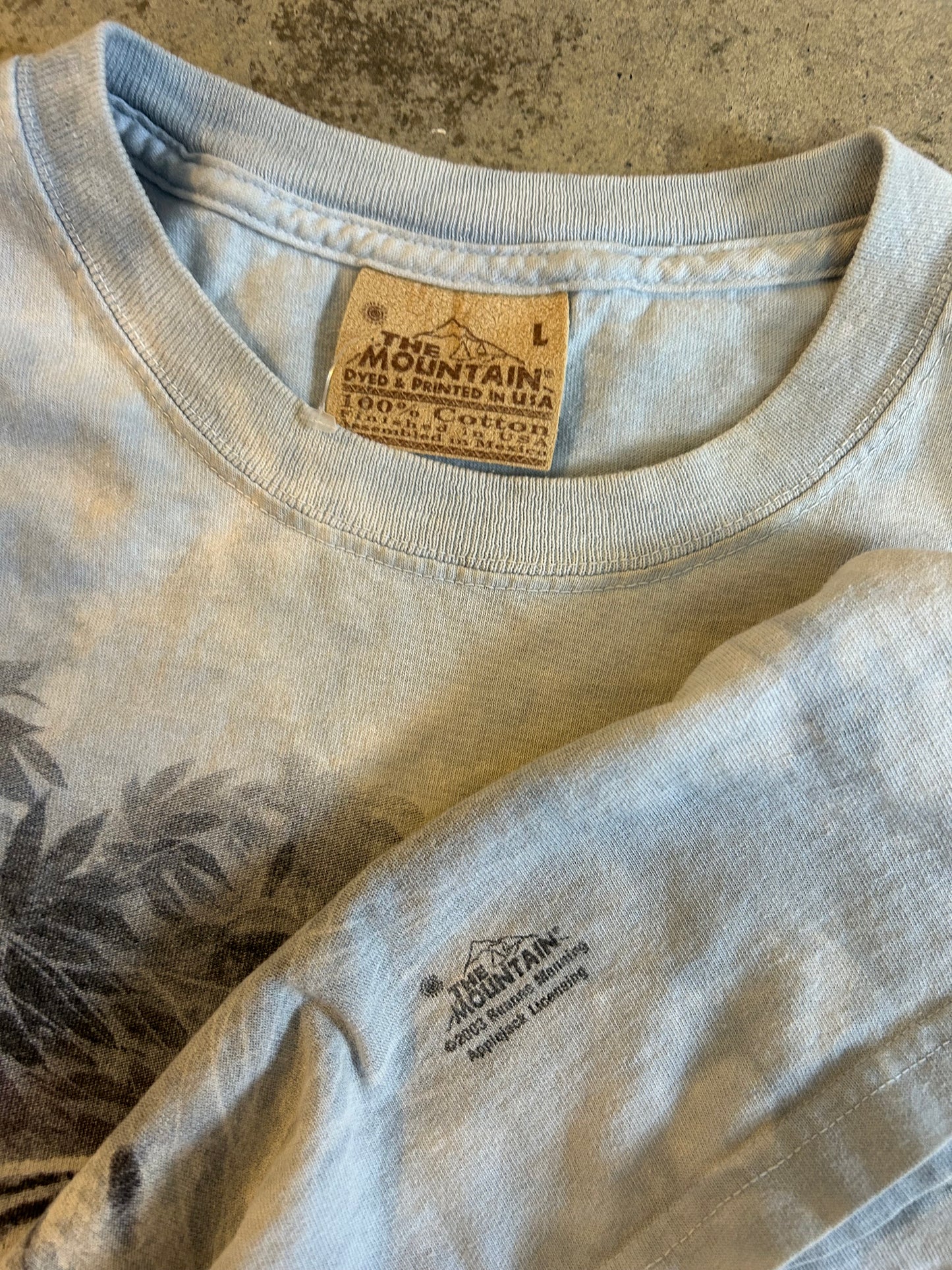 Vintage 2003 light blue tie-dye The Mountain T-shirt features a bold graphic of a white tiger, a black panther, and a tiger Large