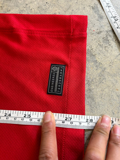 Nike Liverpool FC 2023/24 Home Jersey, featuring a classic red design with prominent white collar and sleeve cuffs. Medium