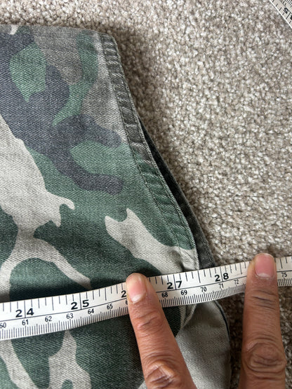 Stussy camouflage cargo shirt featuring a button-up front and a logo patch on the chest Medium