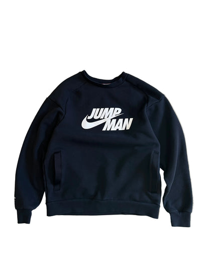 black Jordan Jumpman Men's Fleece Crew Sweatshirt, which features side pockets and a prominent white "JUMPMAN" graphic with the Nike swoosh Medium
