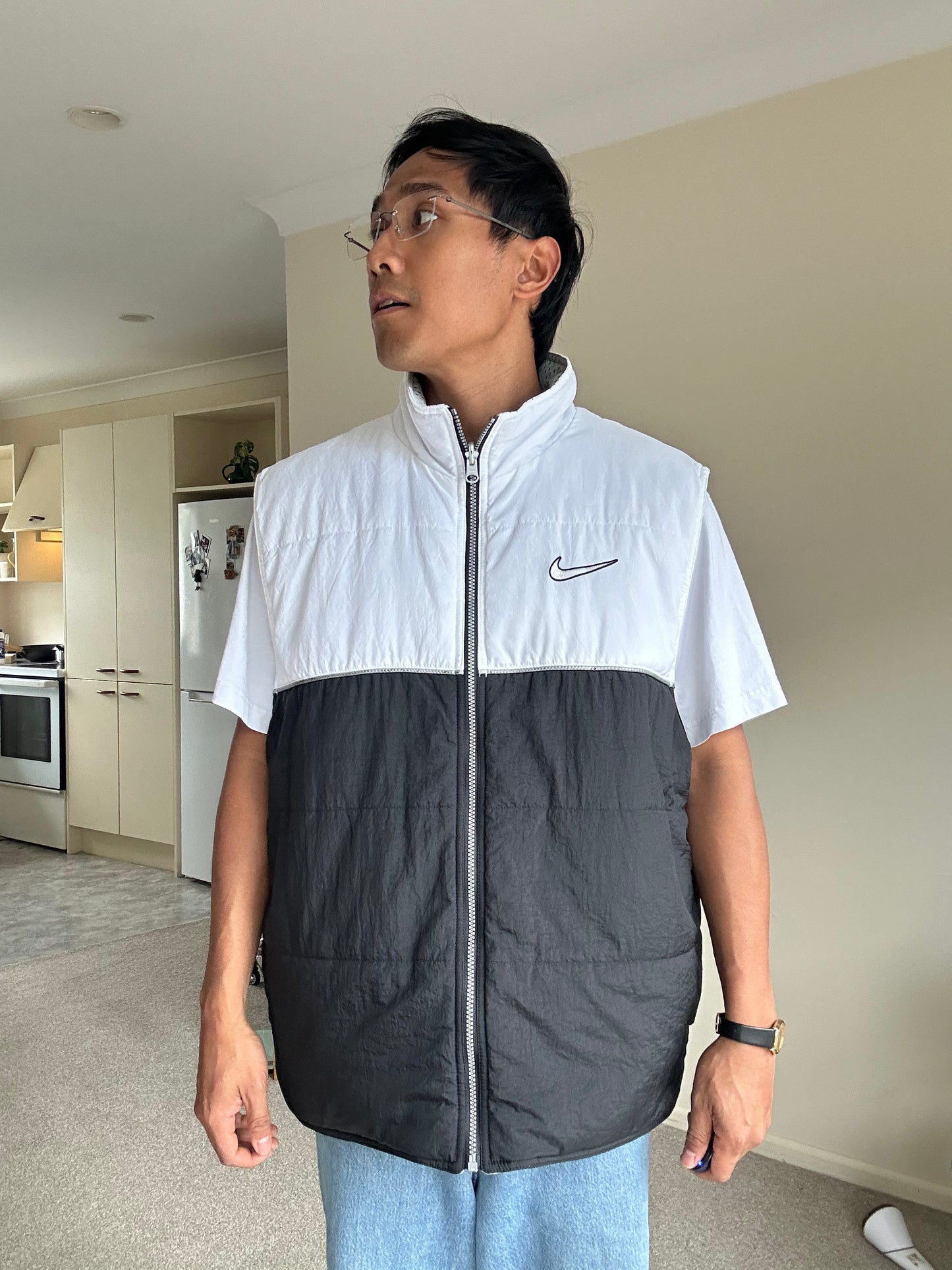 Vintage Nike Sportswear Reversible Puffer Vest in black and white XL
