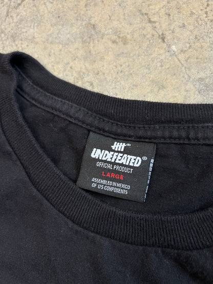 Undefeated and features their iconic five-strike logo filled with a grey camouflage pattern Black Large