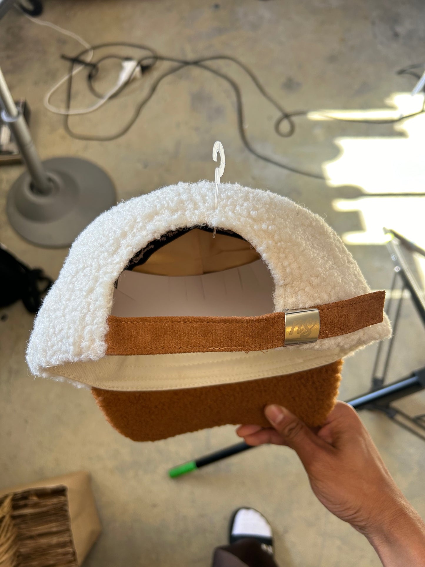 New Shepherds Sherpa Baseball Cap featuring a white fleece crown, a brown brim, and a gold embroidered 'B