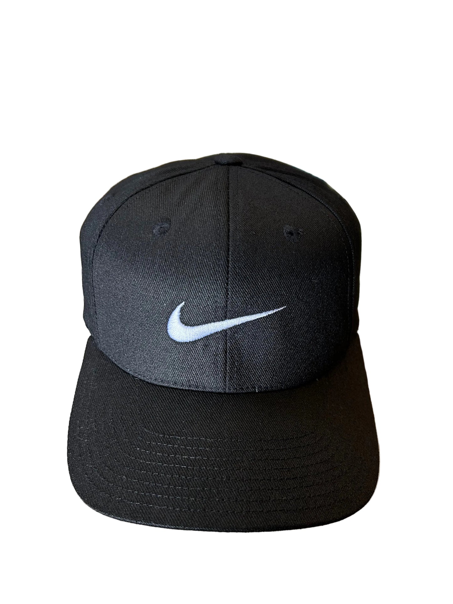 Vintage black Nike baseball cap featuring a white embroidered Swoosh Cotton