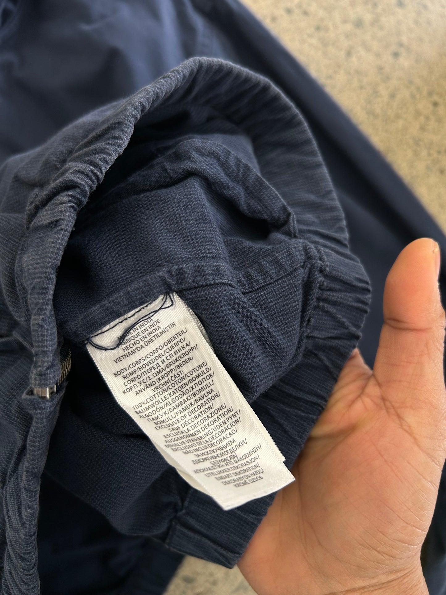 dark blue Polo Ralph Lauren hooded windbreaker features a distinctive red embroidered logo on the chest Navy Blue Large