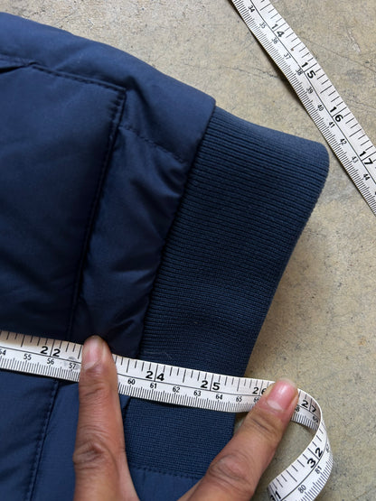 Pertex blue puffer jacket with a red inner lining and red zippers, produced by Levi's Small