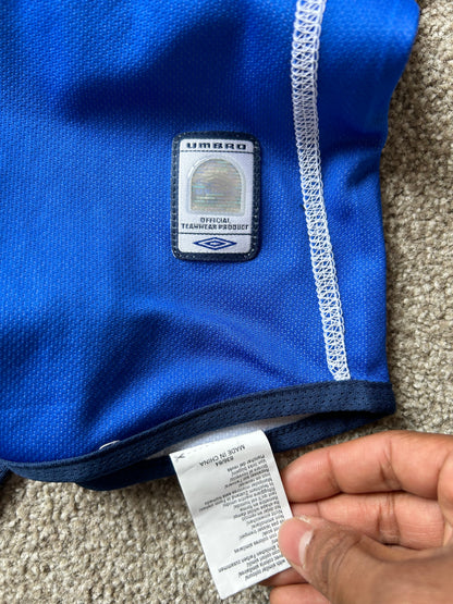 vibrant blue Umbro performance jersey featuring a V-neck design and white piping details XL