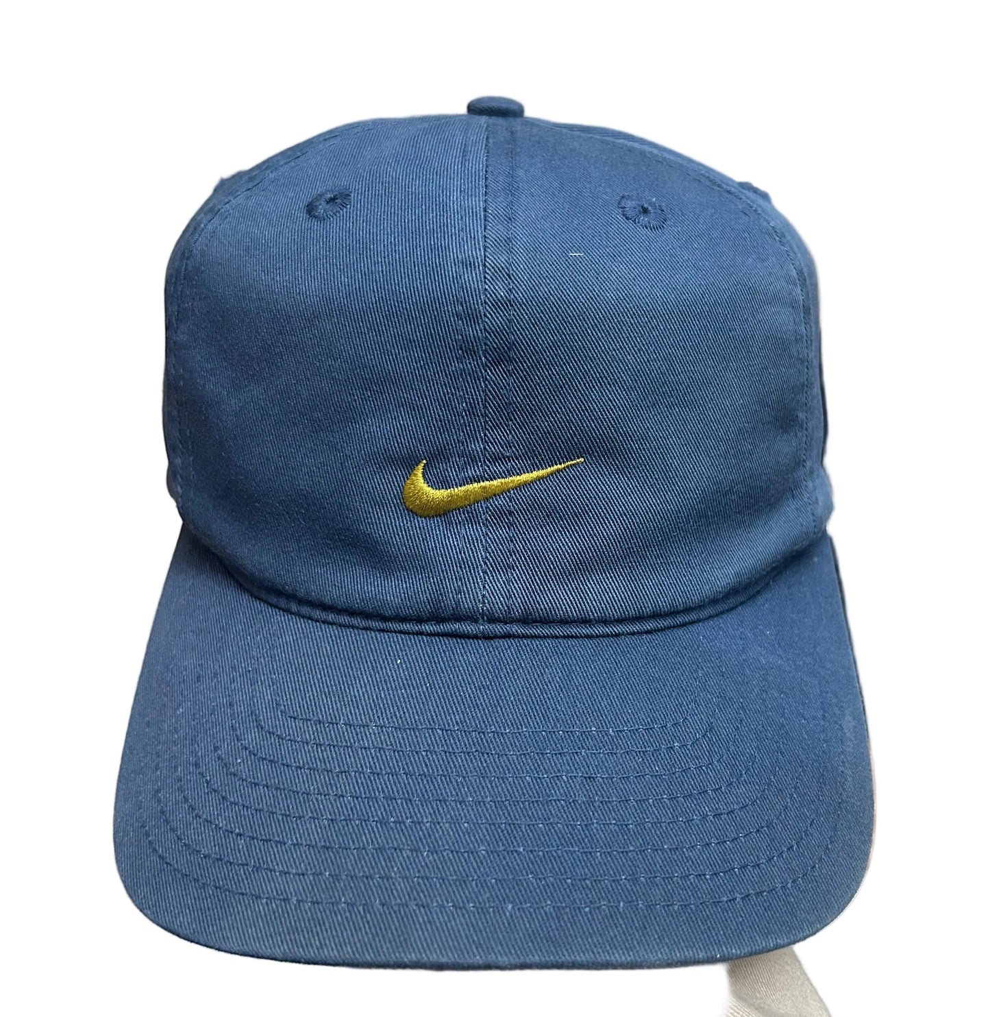 Vintage blue Nike cap featuring an embroidered gold swoosh logo Osfa