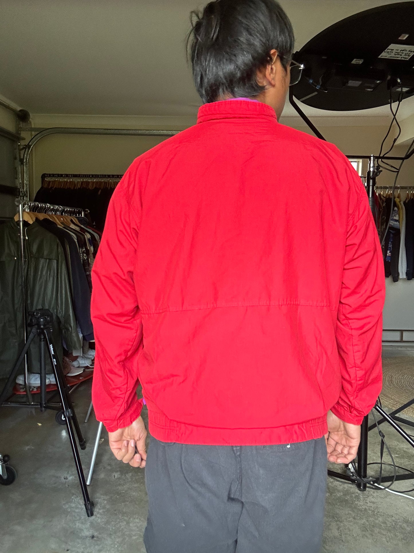 vintage Patagonia jacket, likely from the Fall Line collection, featuring a vibrant red shell and a purple collar Medium