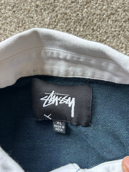 green and navy plaid shirt is the Stussy June Jacquard Rugby Shirt XL