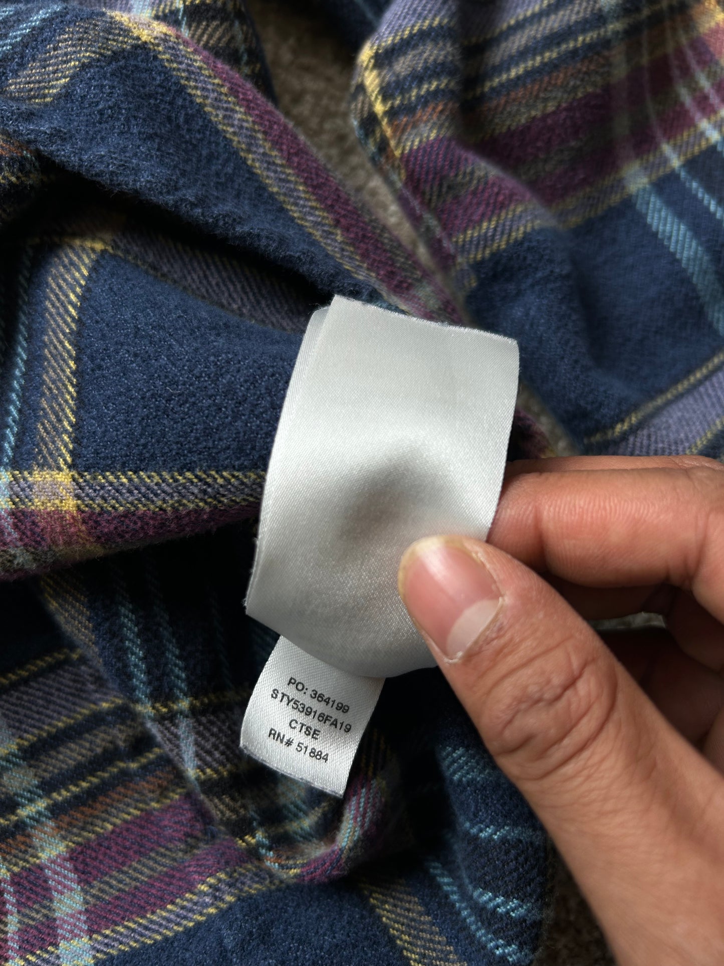 Patagonia Women's Long-Sleeved Fjord Flannel Shirt in a blue and purple plaid pattern, made from 100% organic cotton