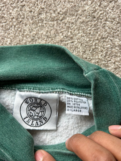 a dark green base with a multicolored Aztec and geometric pattern, characteristic of 1980s and 90s knitwear designs. XL