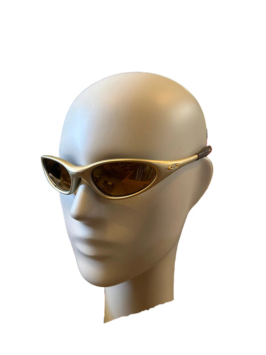 authentic vintage Oakley Minute sunglasses featuring a gold frame and brown lenses Color Powder