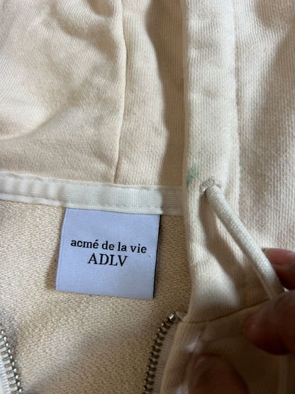 cream-colored zip-up hoodie  "Acmé de la Vie" (ADLV)