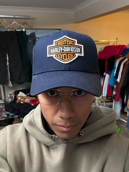 dark navy Harley-Davidson baseball cap features a prominent embroidered bar and shield logo on the front OSFa