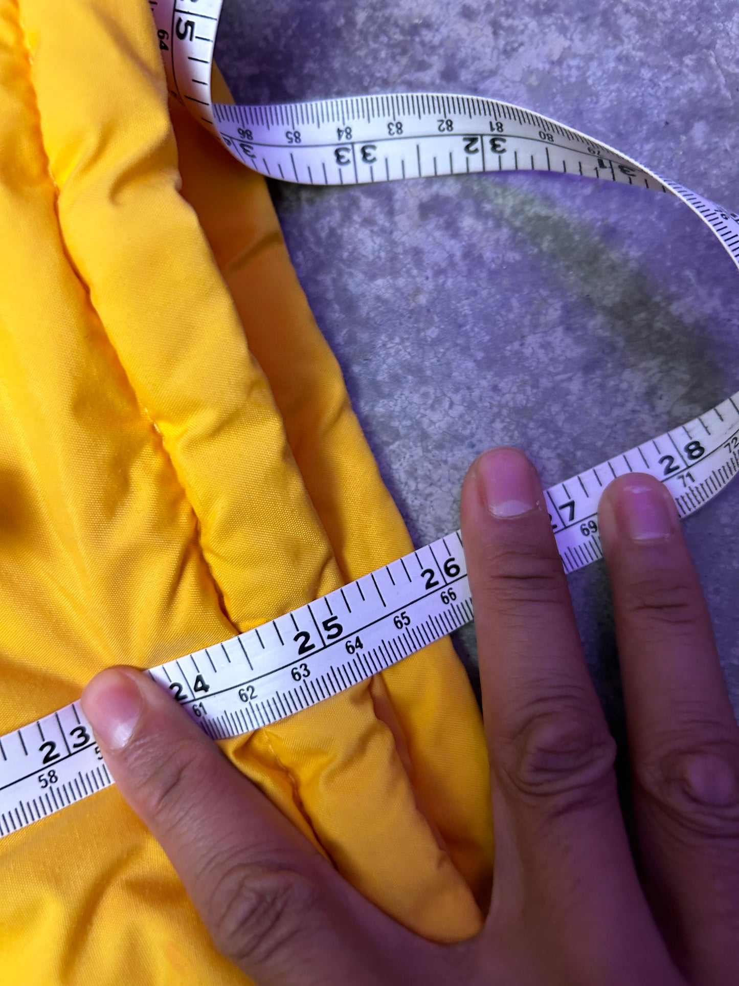 Medium vintage yellow Columbia Sportswear jacket with a blue stripe design across the chest. Has Stains