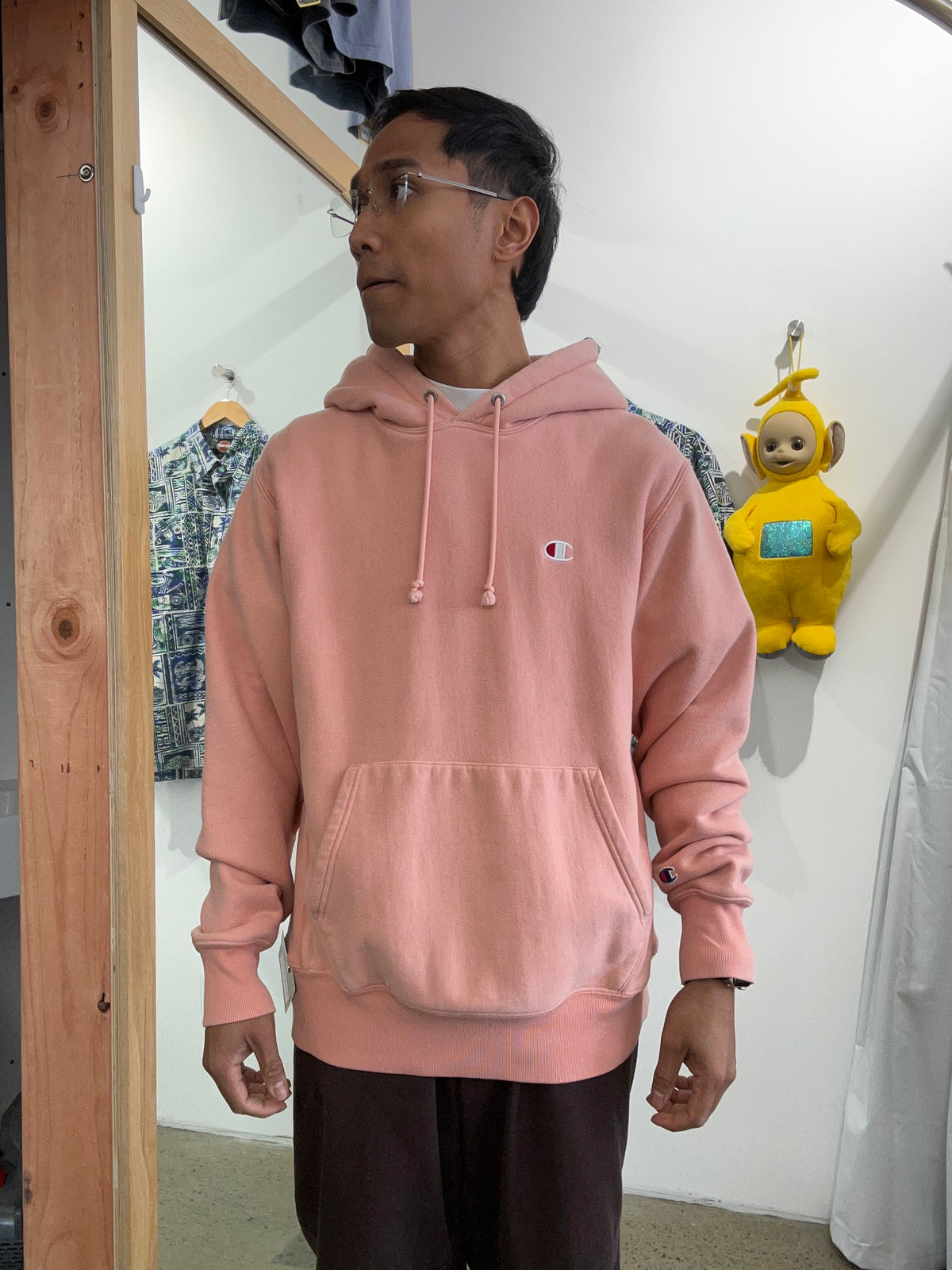 Champion Reverse Weave Small C Hoodie in a light pink or rose shade Medium