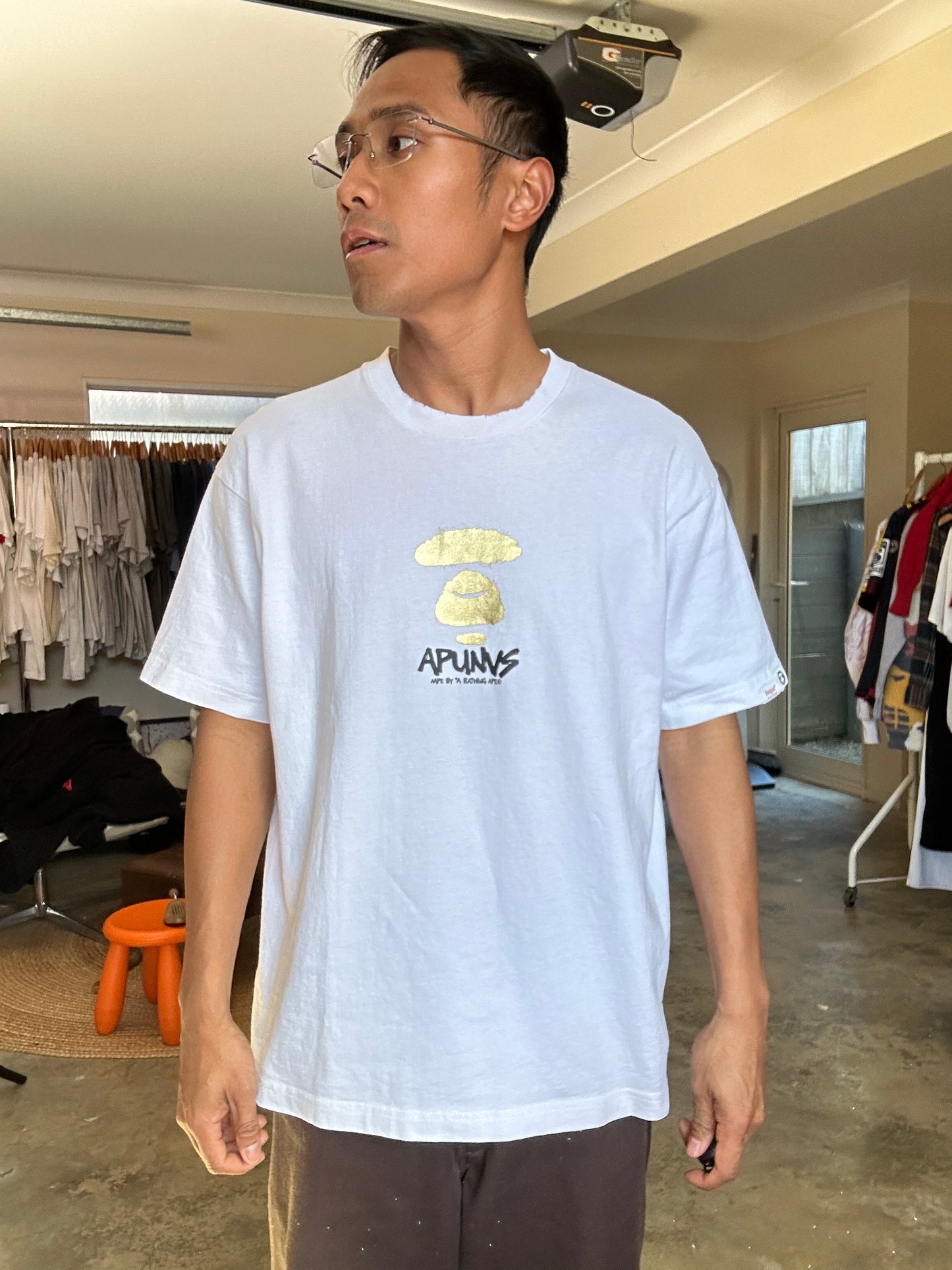 white t-shirt is the AAPE by A Bathing Ape logo-print T-shirt Small