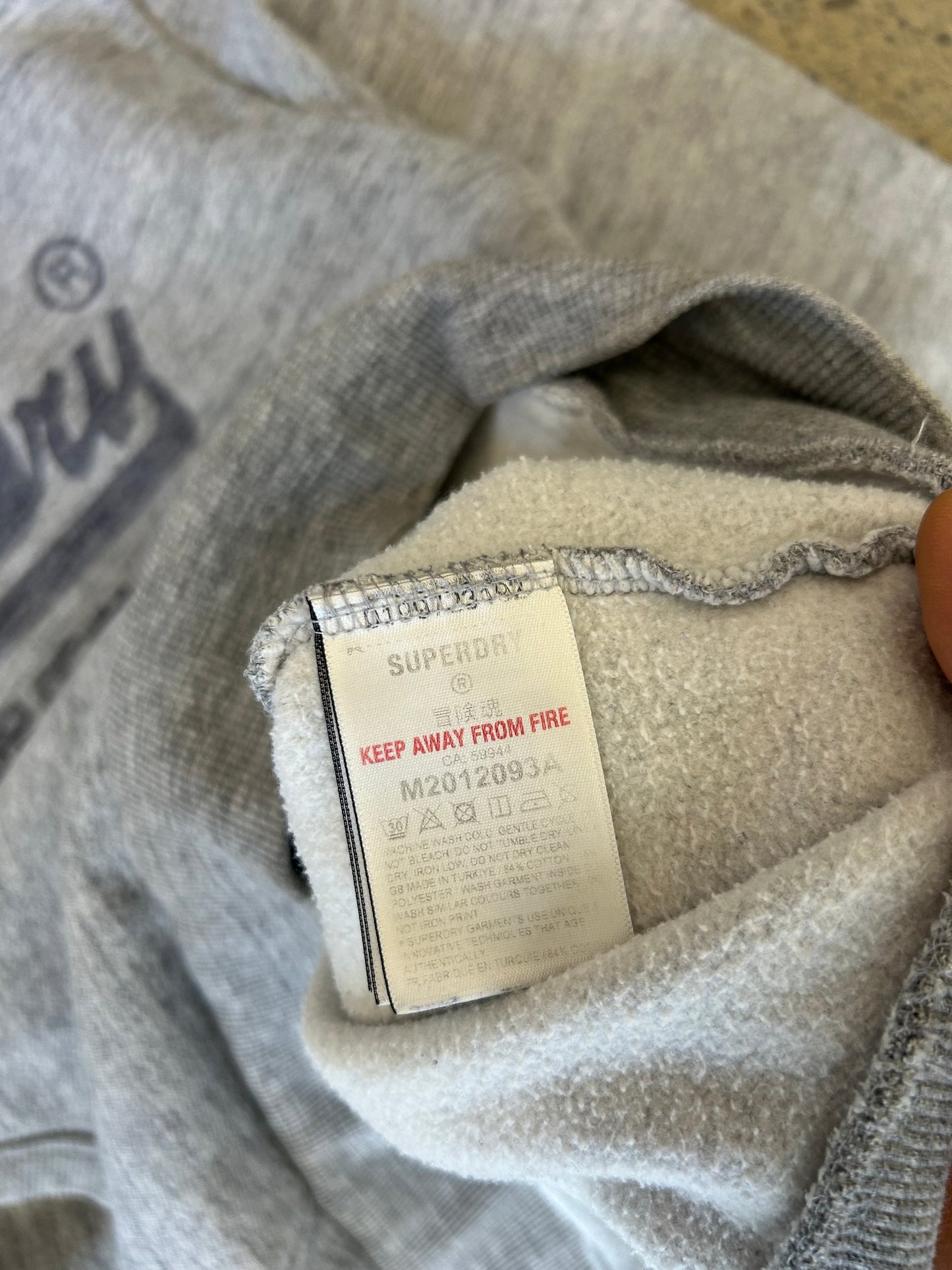 heather grey Superdry Vintage Logo Heritage Hoodie features a distinct cracked graphic print on the chest