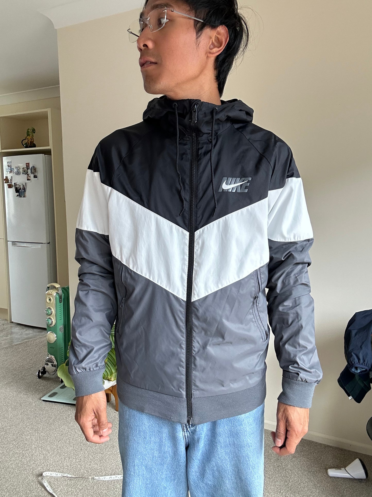 Nike Men's Sportswear Windrunner Jacket in a black, white, and dark grey colorway, model number AJ1396-010 Small