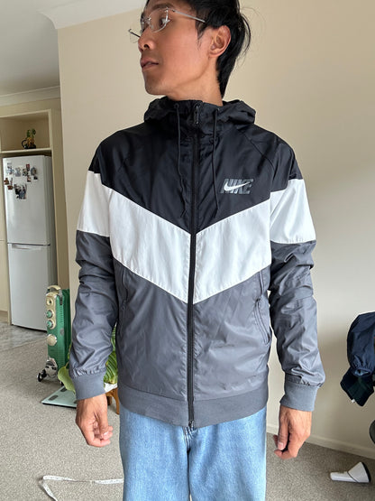 Nike Men's Sportswear Windrunner Jacket in a black, white, and dark grey colorway, model number AJ1396-010 Small