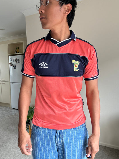 1999-00 Scotland Umbro away football shirt, featuring a distinct coral red body with navy blue accents XS Youth 10-12